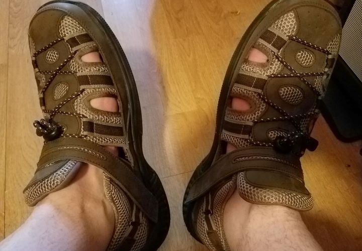 Testing the sandal to check if it offers stretchable and roomy uppers for comfortability