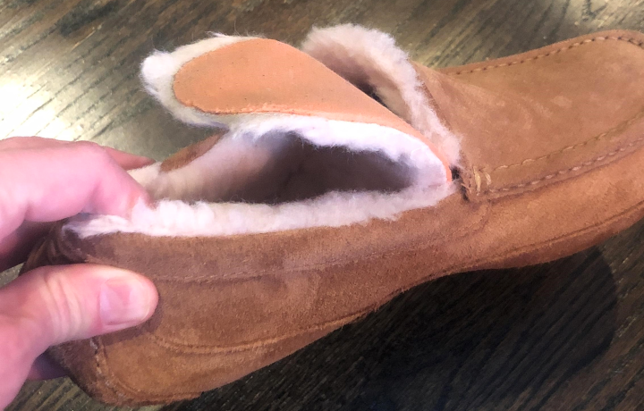 Inspecting the insole of the sandal if it offers a better arch support