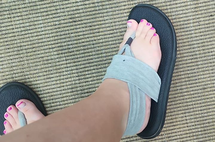 Wearing out the Sanuk Yoga Sling  zero-drop sandal in a grey color