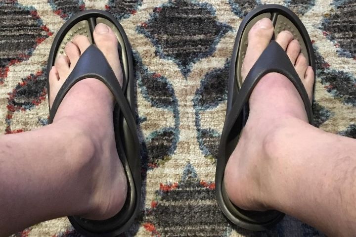 Wearing the anti-slip flipflops from Crocs Athens