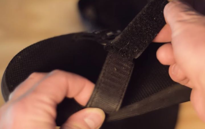 Reviewing the soft straps of the sandal to ensure it offers an adjustable fit