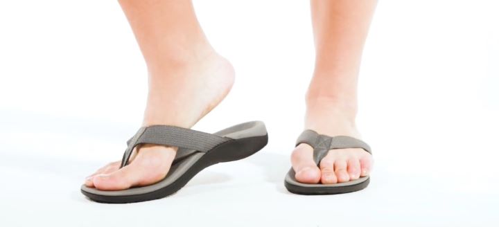 Wearing a color grey orthopedic flip flops